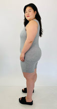Load image into Gallery viewer, Side view of a size 16 Pretty Little Thing light heather gray sleeveless unitard styled with black slide sandals on a size 14/16 model.