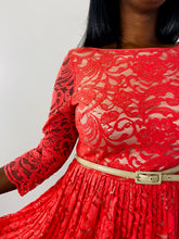 Load image into Gallery viewer, Close up detail shot of the bodice of this size 16 Eliza J coral lace long sleeve pleated midi dress with cream lining on a size 12 model.