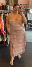 Load image into Gallery viewer, Additional full-body front view of a size 20 (fits like 16) Eloquii cream and peach vertical striped paillette maxi dress with slit styled with a tan mules and sunglasses on a size 14/16 model.