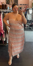 Load image into Gallery viewer, Full-body front view of a size 20 (fits like 16) Eloquii cream and peach vertical striped paillette maxi dress with slit styled with a tan mules and sunglasses on a size 14/16 model.