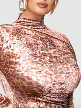 Load image into Gallery viewer, Close up detail shot of the cut out at the neckline and the sheen of the fabric on this size 12 Bloomchic leopard pattern ruched bodycon mini dress with long sleeves, ruching details, and a cut out at the neckline on a size 14 model.