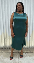 Load image into Gallery viewer, Additional full-body front view of a size 12/14 Henning deep teal silky sleeveless midi dress styled with black kitten heels on a size 14/16 model. The photo was taken outside in natural lighting.
