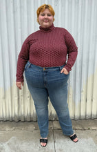 Load image into Gallery viewer, Full-body front view of a size 4 Fashion to Figure x Gabi Fresh maroon &amp; off-white 70s floral turtleneck top styled tucked into medium wash denim on a size 22/24 model. The photo is taken outside in natural lighting.
