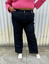 Load image into Gallery viewer, Front view of a pair of size 20 DC Jeans dark wash wide leg denim styled with a bubblegum pink cropped sweater and white mules on a size 18/20 model. The photo was taken outside in natural lighting.
