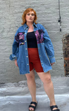 Load image into Gallery viewer, Full-body front view of a size XL Lanvin painted Batman denim button-up styled open over a black tank and red shorts a size 18 model. The photo is taken outside in natural lighting.
