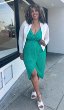 Load image into Gallery viewer, Full-body front view of a size 0 Torrid white collarless blazer styled open over a kelly green wrap dress and white slides on a size 16/18 model.
