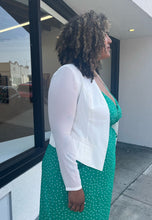 Load image into Gallery viewer, Side view of a size 0 Torrid white collarless blazer styled open over a kelly green wrap dress on a size 16/18 model.
