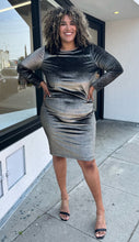 Load image into Gallery viewer, Additional full-body front view of a size 2X Rachel Roy metallic brown-gold velvet long sleeve bodycon midi dress with ruching at the sides styled with black and clear heels on a size 16/18 model. The photo is taken outside in natural lighting.
