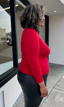 Load image into Gallery viewer, Side view of a size 1X Talbots red cashmere turtleneck sweater styled with black leather pants on a size 16/18 model. The photo is taken outside in natural lighting.
