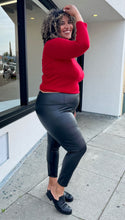 Load image into Gallery viewer, Side view of black Avex Les Filles Skinny Pants on a size 16/18 model. The pants have a thick waistband and the model is wearing a red turtleneck sweater with them.  
