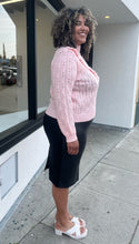 Load image into Gallery viewer, Side view of a soft pink Eloquii sweater in a size 18/20 on a size 16/18 model.
