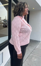 Load image into Gallery viewer, Side view of a soft pink Eloquii sweater in a size 18/20 on a size 16/18 model.

