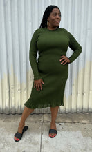 Load image into Gallery viewer, Additional full-body front view of a size XXL Rachel Parcell forest green all-over smocking long sleeve midi dress with mock neckline and ruffle hem styled with black slides on a size 14/16 model. The photo is taken outside in natural lighting.
