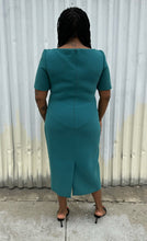 Load image into Gallery viewer, Full-body back view of a size 16 Zac Posen via 11 Honoré teal boatneck sheath dress styled with black kitten heels on a size 14/16 model. The photo is taken outside in natural lighting.
