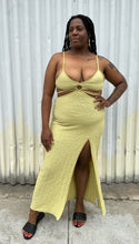 Load image into Gallery viewer, Additional full-body front view of a size XL Urban Outfitters chartreuse textured cut-out maxi dress with a side slit styled with black sides on a size 14/16 model. The photo is taken outside in natural lighting.
