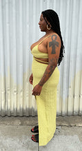 Load image into Gallery viewer, Full-body side view of a size XL Urban Outfitters chartreuse textured cut-out maxi dress with a side slit styled with black sides on a size 14/16 model. The photo is taken outside in natural lighting.
