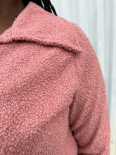 Load image into Gallery viewer, Close up view of the furry texture of a LIVD Apparel size 1X dusty rose fuzzy collared crop jacket on a size 14/16 model. The photo is taken outside in natural lighting.
