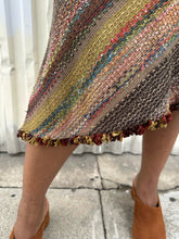 Load image into Gallery viewer, Close up of the woven texture of a size 14 Nancy Bolen City Girl vintage earth tone horizonatl striped midi skirt styled with a ribbed whit tank and warm tone brown mules on a size 14 model. The photo is taken outside in natural lighting.
