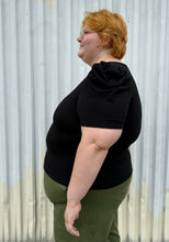Load image into Gallery viewer, Side view of a size 3X Forever 21 black subtle puff sleeve t-shirt styled over green cargo pants on a size 22/24 model. The photo is taken outside in natural lighting.
