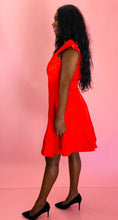 Load image into Gallery viewer, Full-body side view of a size 14 Zac Posen for 11 Honoré vibrant red floral burnout pattern a-line midi dress with cap sleeves and burnout stripe hem styled with black pumps on a size 10/12 model.
