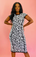 Load image into Gallery viewer, Additional front view of a size XL Michael Kors black and white textured floral midi sheath dress with cap sleeves on a size 10/12 model.
