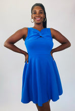 Load image into Gallery viewer, A size 14/16 Milly for 11Honoré cobalt blue a-line sleeveless mini dress with twisted neckline on a size 12 model.
