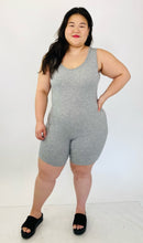 Load image into Gallery viewer, A size 16 Pretty Little Thing light heather gray sleeveless unitard styled with black slide sandals on a size 14/16 model.
