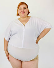 Load image into Gallery viewer, A size 3 Fashion to Figure x Sarah Rae Vargas crisp white wide-sleeved bodysuit with stretch at the bottom on a size 22 model.

