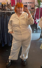 Load image into Gallery viewer, Full-body front view of a size 5X Big Bud Press off-white collared boiler suit/jumpsuit with zip-front details styled with black mary janes on a size 22/24 model
