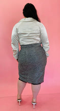 Load image into Gallery viewer, Full-body back view showcasing the pencil skirt in this size 18 Lela Rose gray tweed, textured blazer and skirt 2-piece suit set with black unfinished fringe hem styled with an off-white button-up top on a size 14/16 model.
