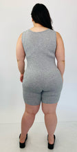 Load image into Gallery viewer, Back view of a size 16 Pretty Little Thing light heather gray sleeveless unitard styled with black slide sandals on a size 14/16 model.
