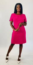 Load image into Gallery viewer, Additional full-body front view of a size 16 Kasper vintage hot pink short sleeve shift dress with embroidered floral details and white strappy sandals on a size 12 model.
