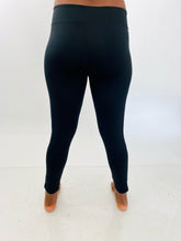 Load image into Gallery viewer, Back view of a pair of size XL Adidas black active leggings with the &quot;Adidas&quot; logo down the side on a size 12 model.
