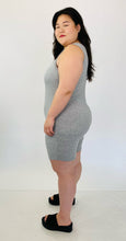 Load image into Gallery viewer, Side view of a size 16 Pretty Little Thing light heather gray sleeveless unitard styled with black slide sandals on a size 14/16 model.
