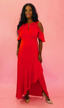 Load image into Gallery viewer, Full-body front view of a size 12 Monique Lhuillier for 11 HONORÉ vibrant red ruffled maxi with asymmetrical tulip hem, cold-shoulders, and keyhole bust detail styled with tan pumps on a size 10/12 model.

