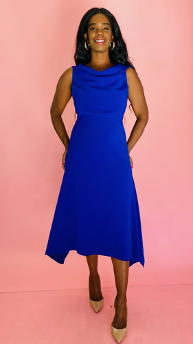 Full-body front view of a size 16 Reem Acra for 11 Honoré cobalt blue subtle cowl neck sleeveless maxi with handkerchief hem styled with tan patent leather heels on a size 10/12 model.