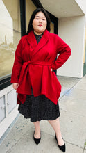 Load image into Gallery viewer, Full-body front view of a size 14 Bloomchic deep red felt collared coat with belt styled closed over a black and white polka dot maxi dress on a size 14/16 model.
