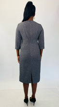 Load image into Gallery viewer, Back view of a size 16 Michael Kors dark gray and silver metallic textured three-quarter sleeve midi dress styled with black pumps on a size 12 model.
