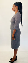 Load image into Gallery viewer, Side view of a size 16 Michael Kors dark gray and silver metallic textured three-quarter sleeve midi dress styled with black pumps on a size 12 model.
