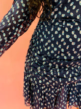 Load image into Gallery viewer, Close up detail shot of the metallic silver and light blue swiss dot sheer overlay on this size 14 Tanya Taylor for 11HONORÉ navy blue long sleeve mini dress with light blue, and metallic silver swiss dot sheer overlay, ruffles and gathering, and a high neck on a size 10/12 model.
