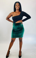 Load image into Gallery viewer, Additional full-body front view of a size 1X Fashion Nova black one-shoulder long sleeve crop top styled with a green velvet bodycon mini skirt and black pumps on a size 12 model.
