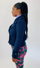 Load image into Gallery viewer, Side view of a size L BB Dakota navy blue blazer-style cropped peacoat styled with a periwinkle sweater and green floral pants on a size 12 model.
