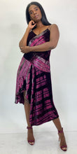 Load image into Gallery viewer, Full-body front view of a size 12 Parker NY for 11 Honoré maroon-purple velvet shift midi dress with asymmertical handkerchief hemline styled with maroon heels on a size 12 model. The photo is taken inside in studio lighting.
