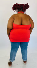 Load image into Gallery viewer, Full-body back view of a size 6 Torrid coral red v-neck halter tank styled with light wash jeans and white slides on a size 26/28 model.
