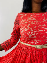 Load image into Gallery viewer, Close up detail shot of the bodice of this size 16 Eliza J coral lace long sleeve pleated midi dress with cream lining on a size 12 model.
