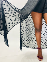 Load image into Gallery viewer, Close up detail shot of the star-printed sheer black mesh maxi overlay with slits on this sexy size 14 Showpo. black lace-up criss-cross detail romper on a size 12 model.
