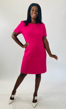 Load image into Gallery viewer, Full-body front view of a size 16 Kasper vintage hot pink short sleeve shift dress with embroidered floral details and white strappy sandals on a size 12 model.
