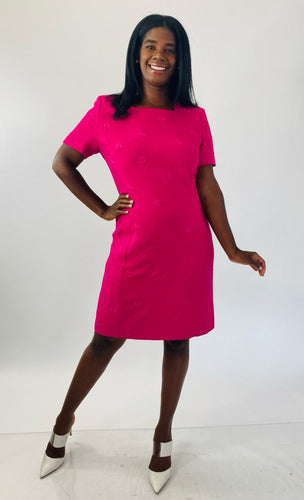 Full-body front view of a size 16 Kasper vintage hot pink short sleeve shift dress with embroidered floral details and white strappy sandals on a size 12 model.