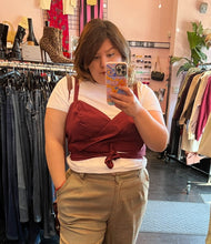Load image into Gallery viewer, Closer front view of a size 16 Eloquii white tee with connected maroon wrap tank detail styled with tan plaid pants on a size 14/16 model.
