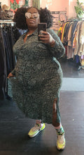 Load image into Gallery viewer, Additional full-body front view of a size 3X 1. State teal and black snakeprint button-up shirt dress styled with shiny sunglasses and neon sneakers on a size 22/24 model.

